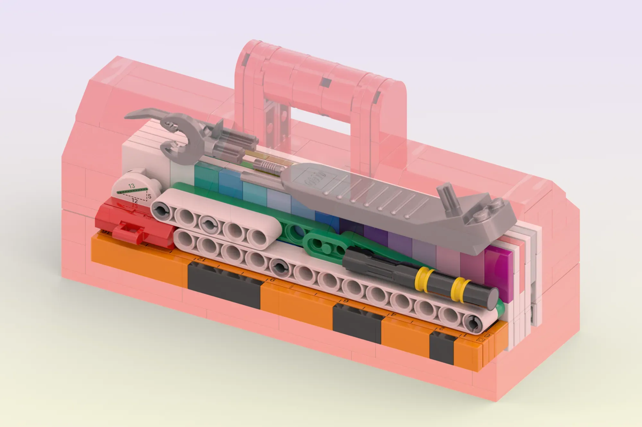 Fan builder luc.afol designed an upscaled LEGO® toolbox filled with brick-themed tools.