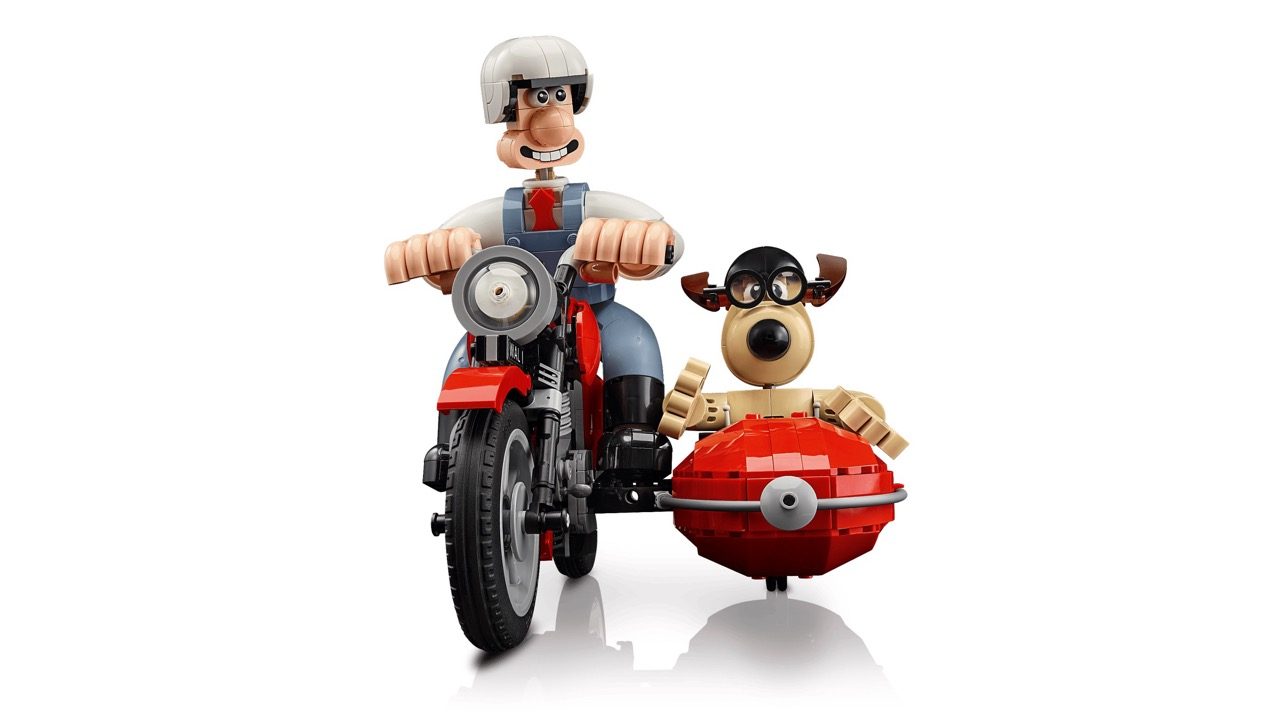 LEGO Wallace & Gromit motorcycle set with minifigure on red bike and Gromit figure in sidecar.