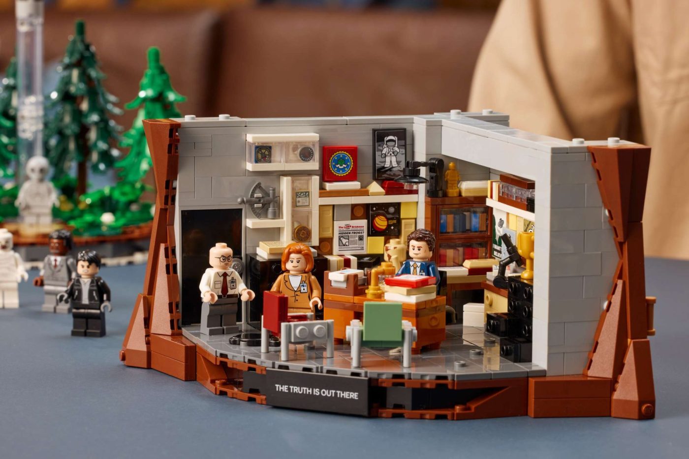 LEGO Ideas The X-Files Set 21369 featuring an office interior with minifigures and "The Truth Is Out There" base.