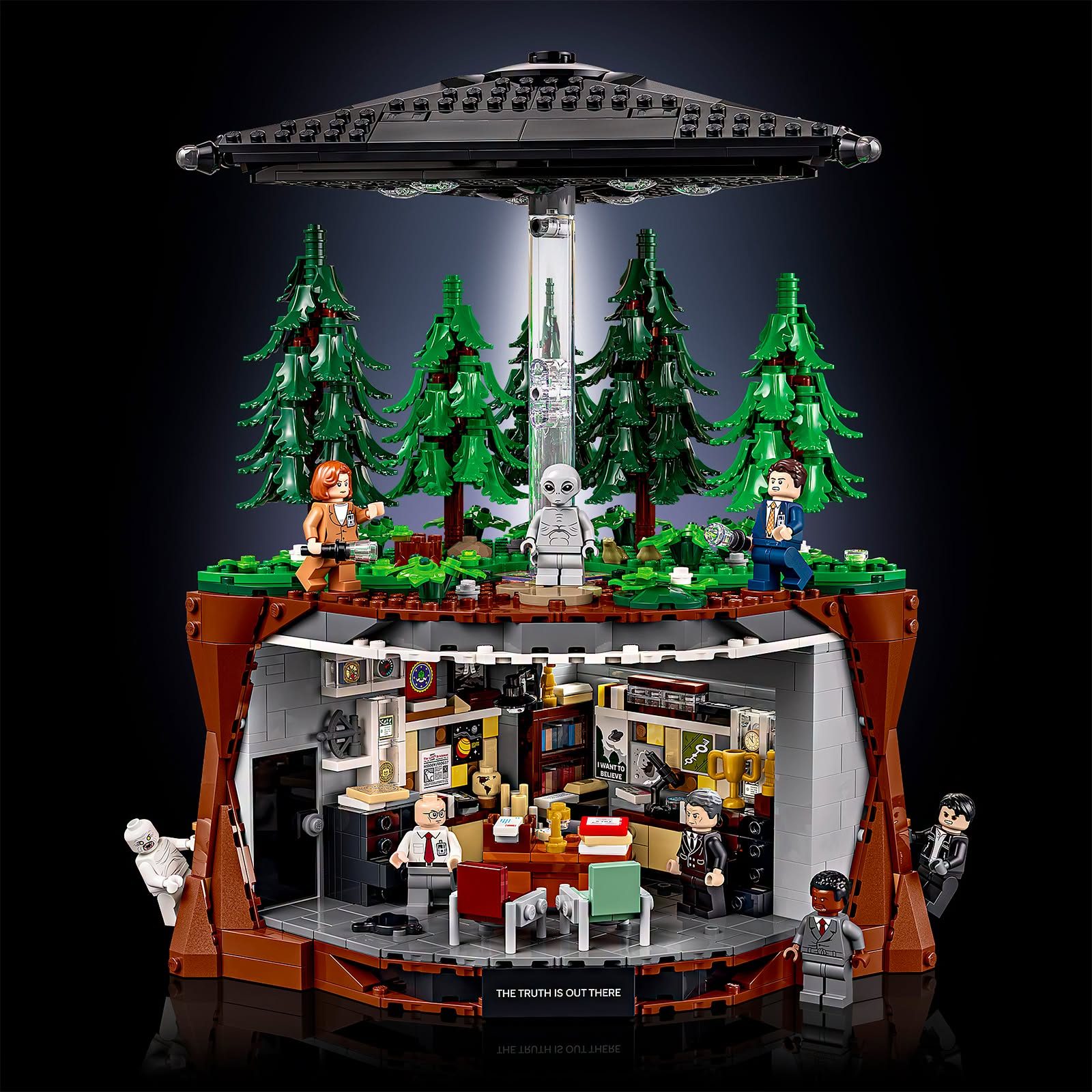LEGO Ideas The X-Files set 21369 featuring UFO, forest scene, office interior, and minifigures including Mulder and Scully.