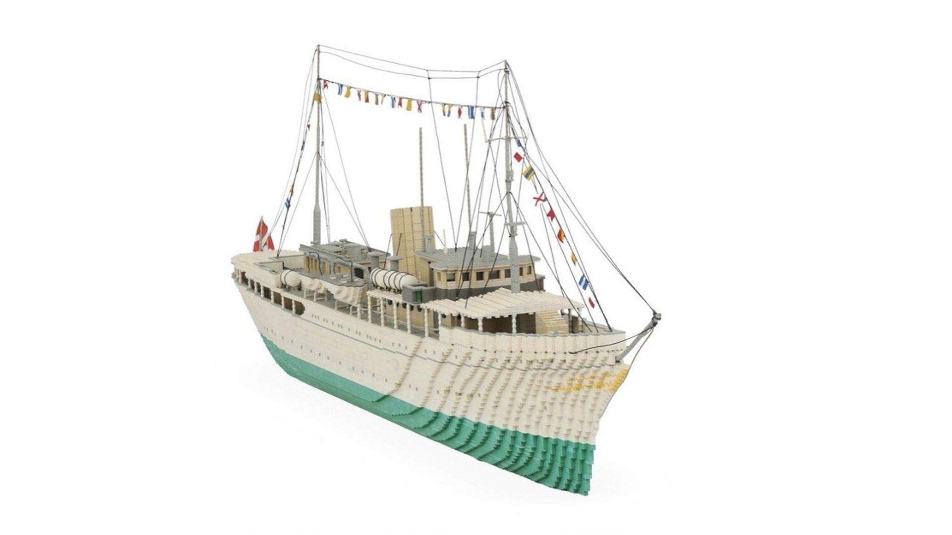 LEGO model of a vintage passenger ship with cream hull, green keel, tan superstructure, and detailed rigging.