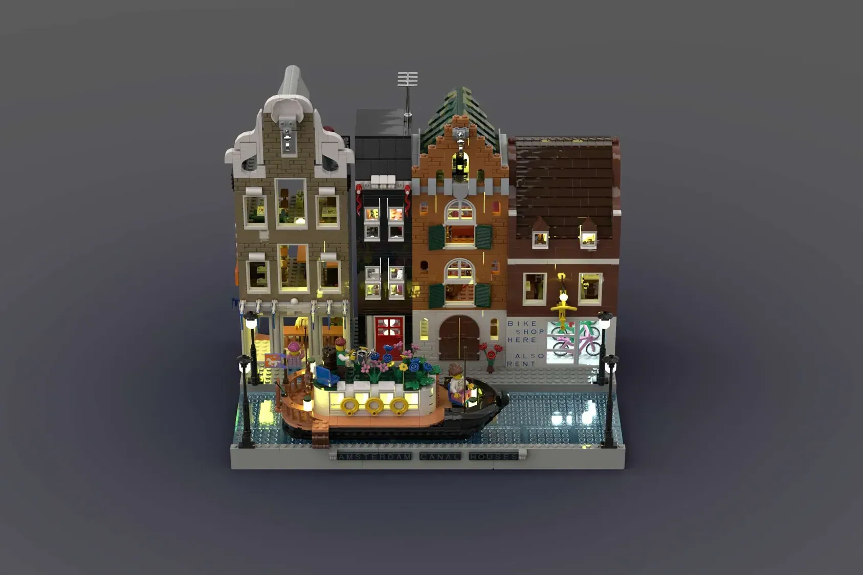 LEGO Amsterdam Canal Houses set with four detailed brick buildings, canal boat, bike shop, and minifigures on baseplate.