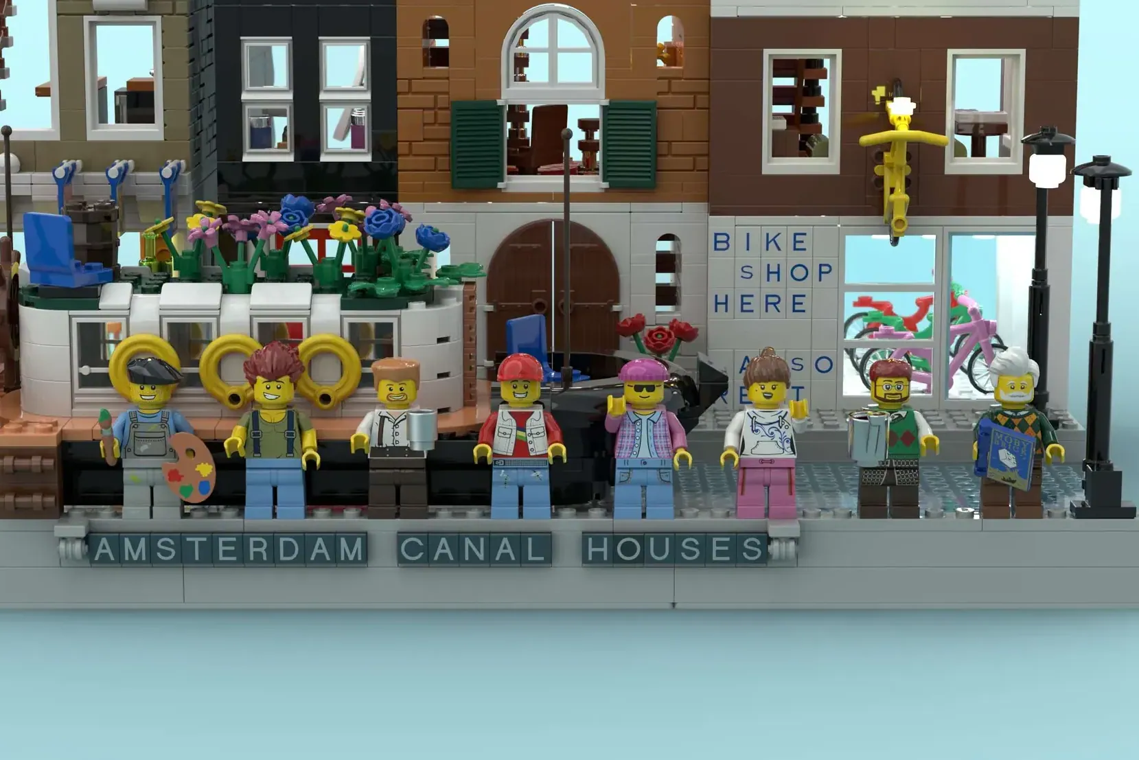 LEGO Amsterdam Canal Houses set with colorful minifigures and detailed brick buildings including a bike shop along a canal.