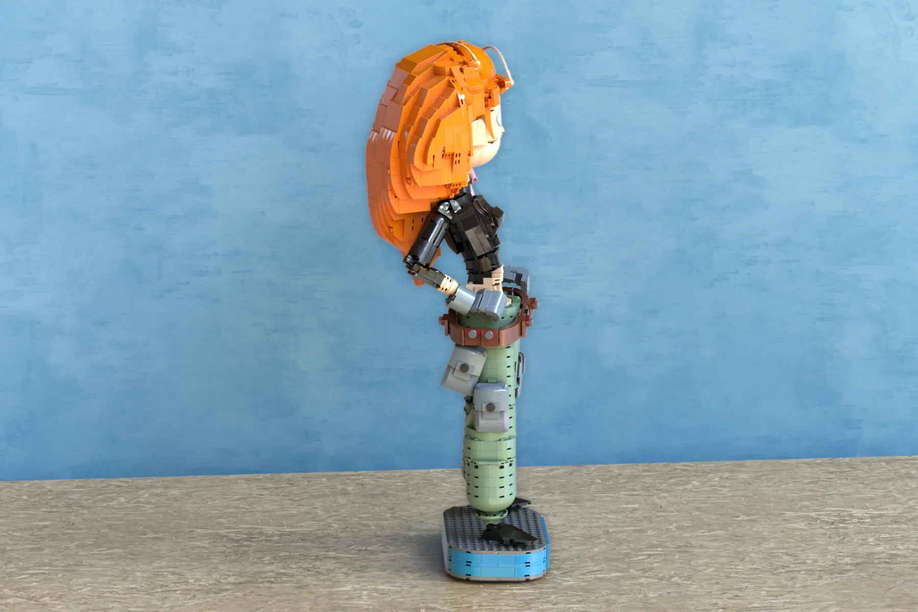 LEGO Ideas Kim Possible figure with orange hair and black outfit on segmented green torso and blue base.