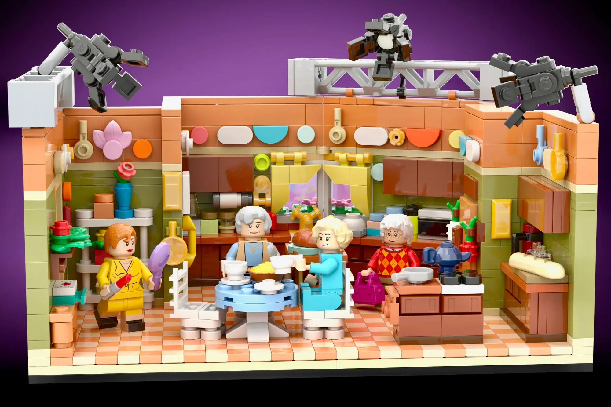 LEGO Golden Girls kitchen set with four elderly female minifigures, detailed furniture, appliances, and camera equipment o…