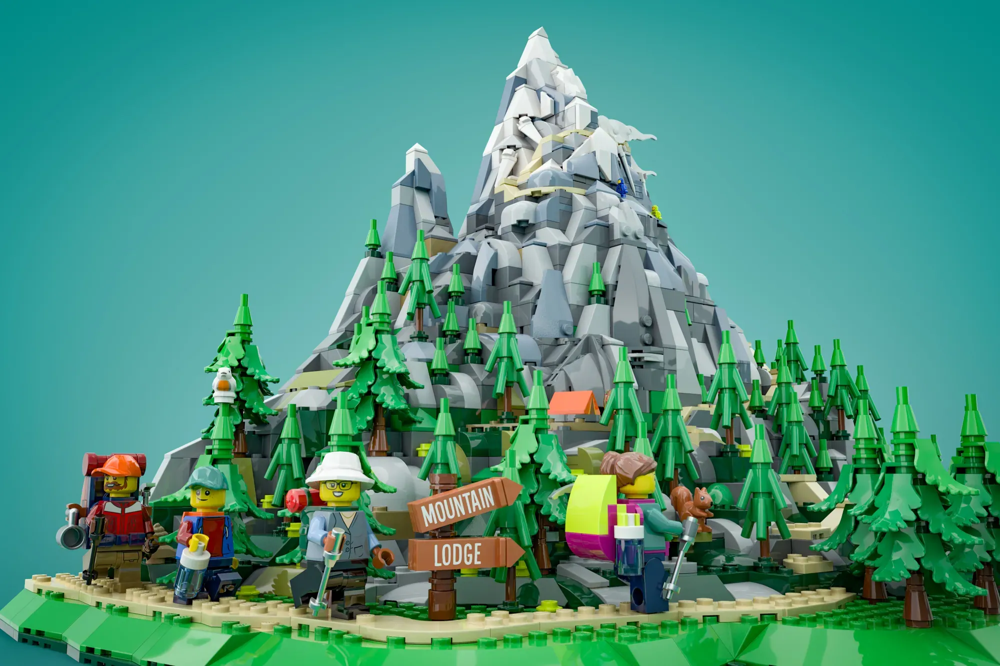 LEGO mountain lodge scene with minifigures, evergreen trees, and a snow-capped peak demonstrating scale perspective trick.