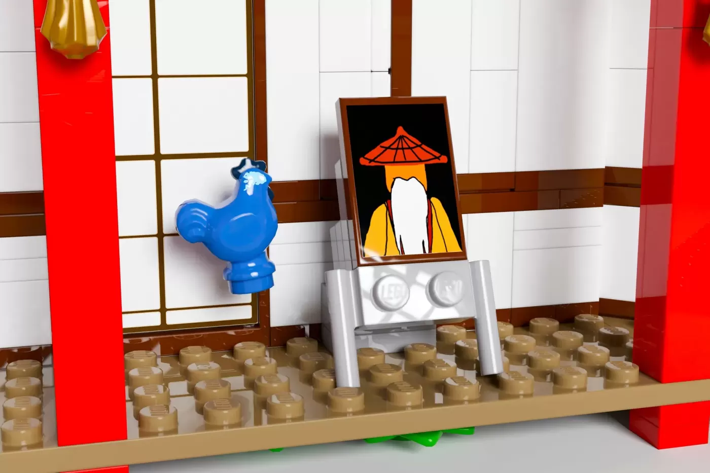 LEGO Ninjago monastery interior with blue rooster figurine, portrait painting, and tan brick flooring.
