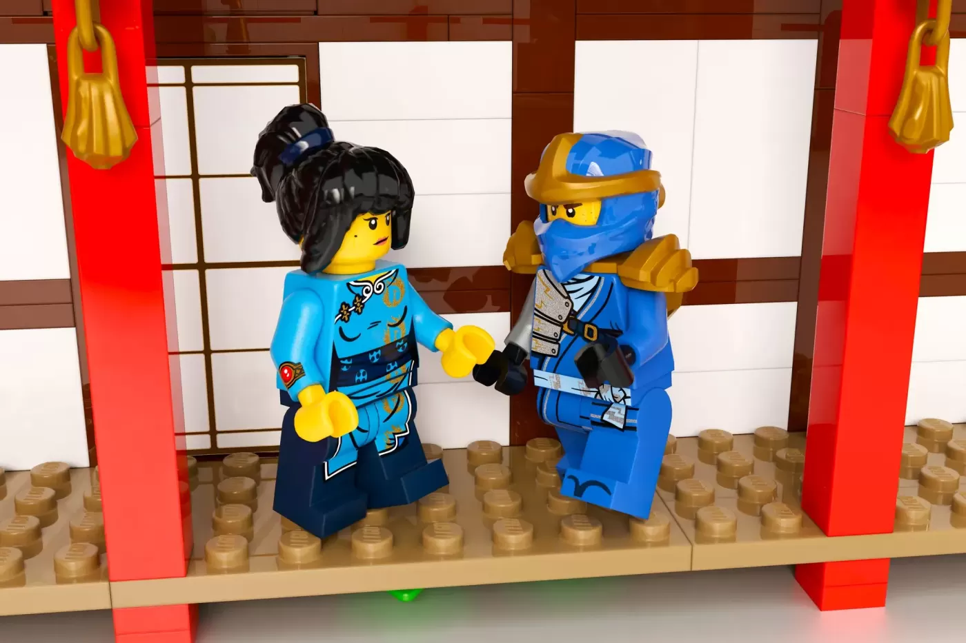 Two LEGO Ninjago minifigures in blue and cyan outfits stand in an Asian-inspired monastery interior with red pillars.