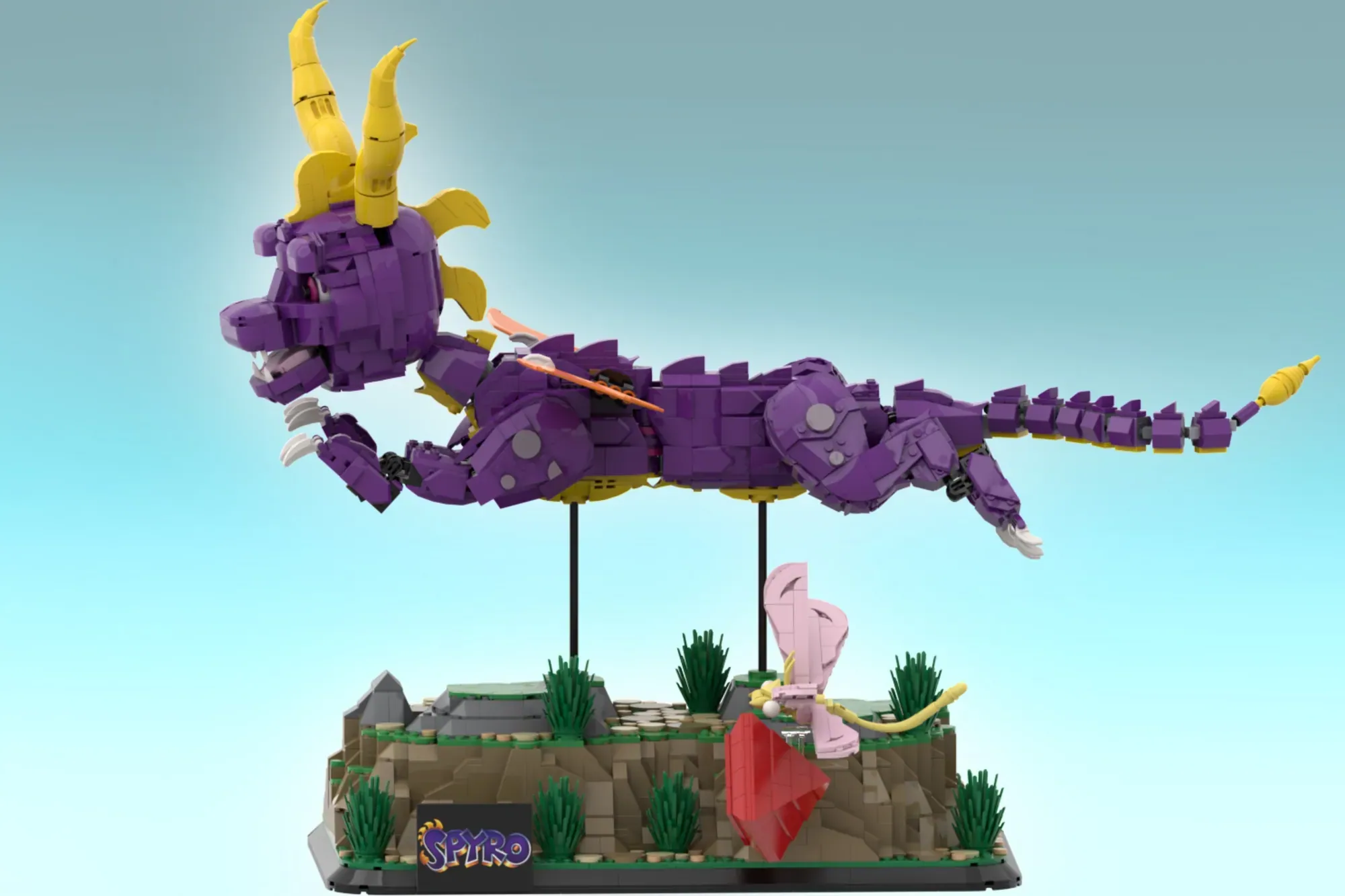 LEGO Spyro the Dragon set with purple dragon figure, yellow horns, pink minifigure, and grassy base display.