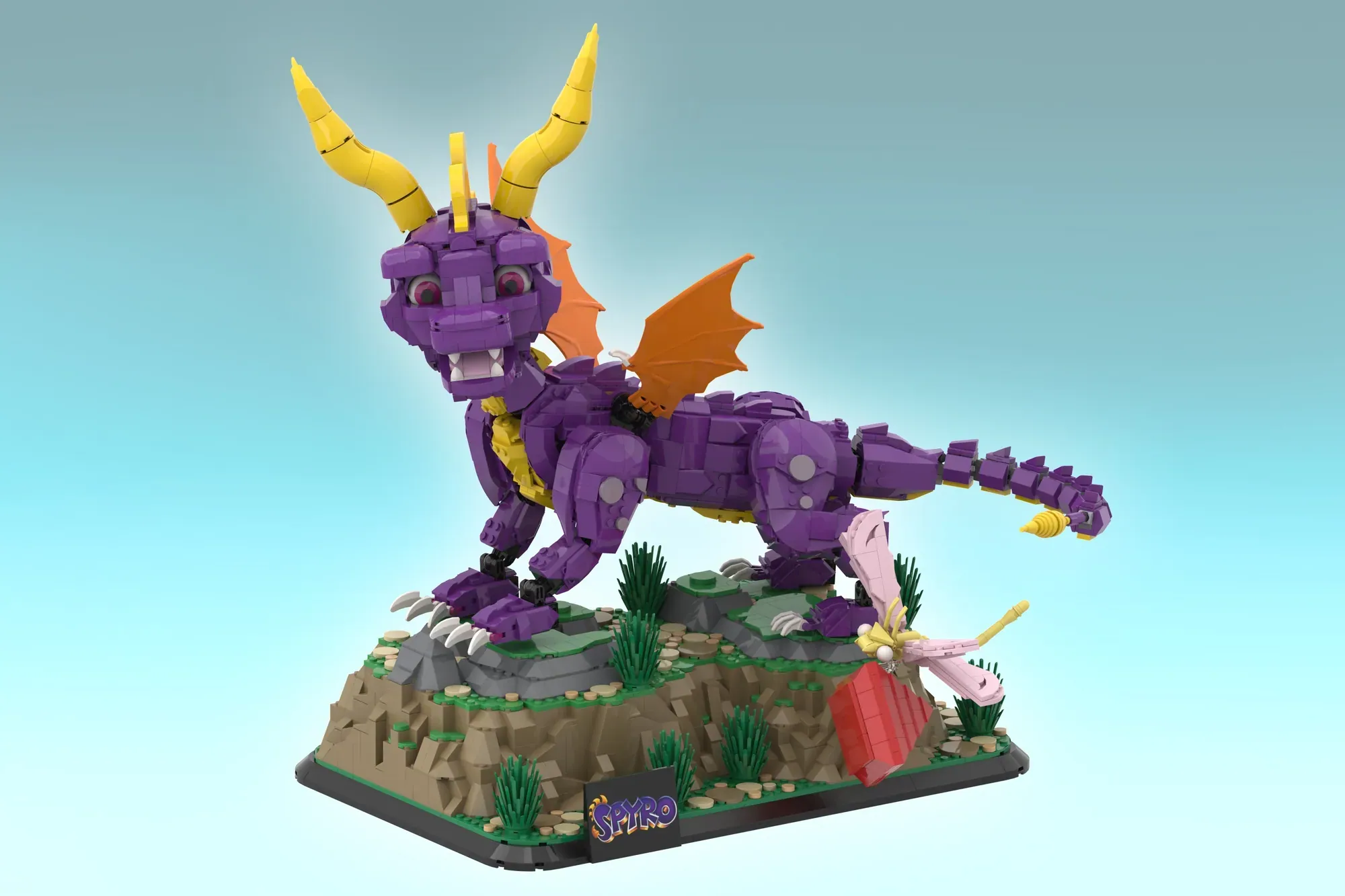 LEGO Spyro the Dragon buildable figure with purple body, yellow horns, orange wings, on grassy terrain base.