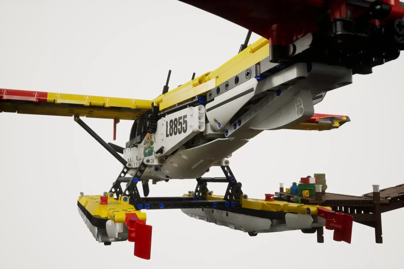 LEGO Cessna 185 float plane with yellow crane and cargo, registration number 18855 visible.